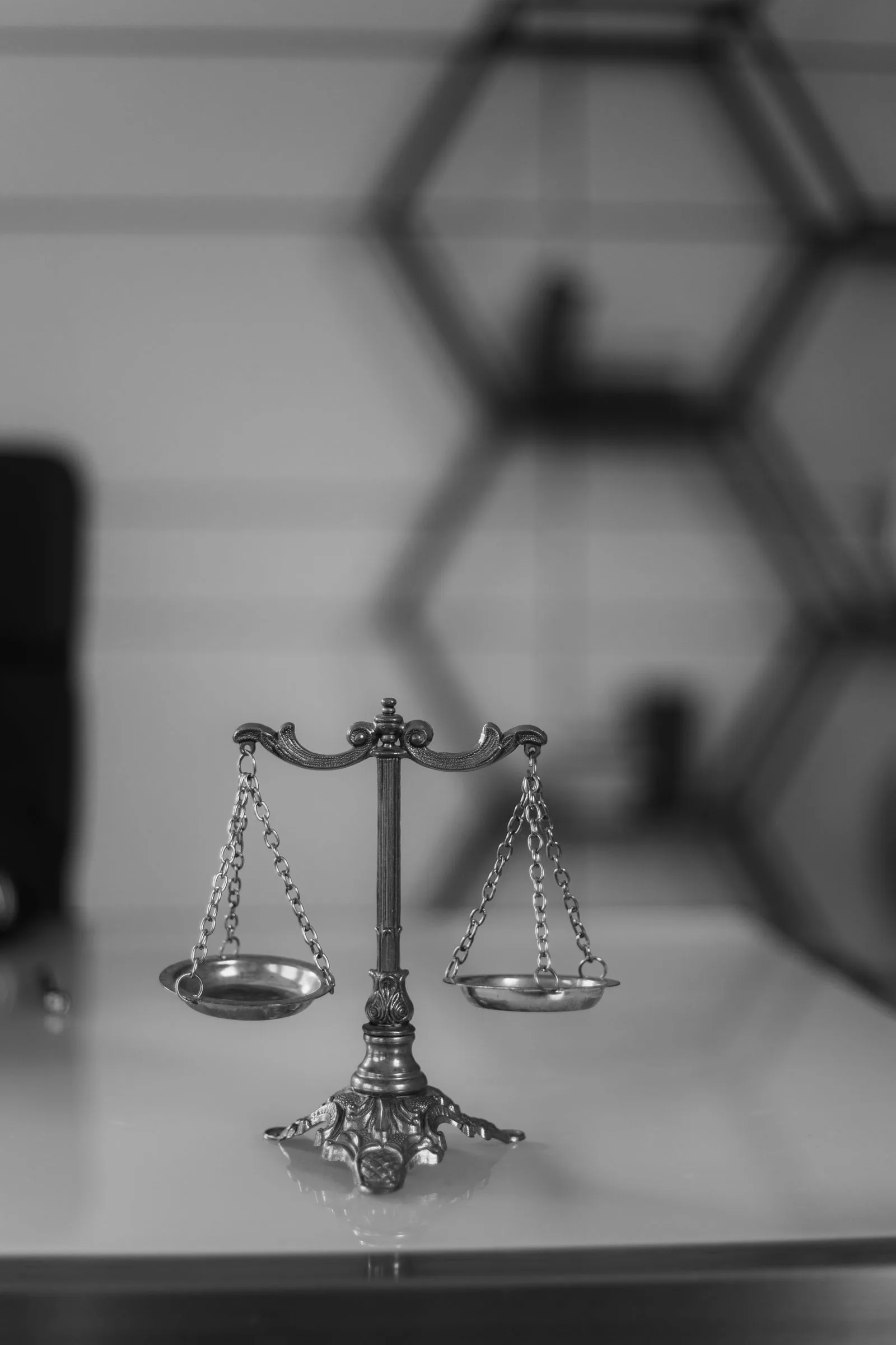 Vintage balance scale against a blurred background, weighing a dealer trade-in price against retail