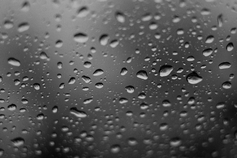 Black and white droplets on glass