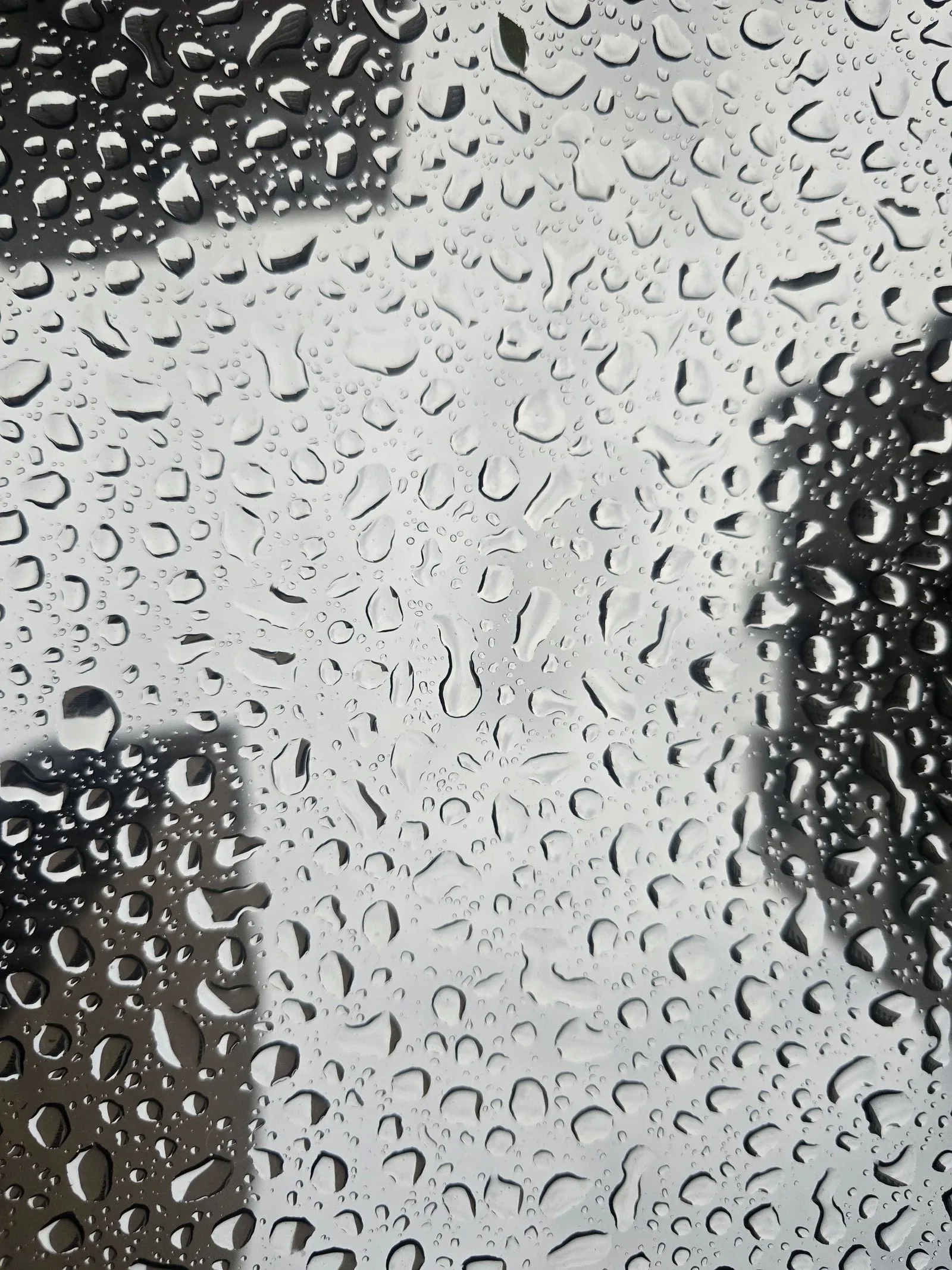 Raindrops on glass in a moody abstract, the conditions Submariner alternatives are rated to handle