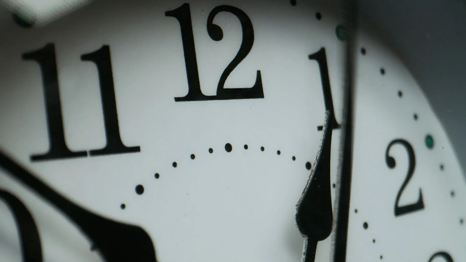 Black numerals and a hand on a pale dial; a homage watch carries its own maker's name, not the original's
