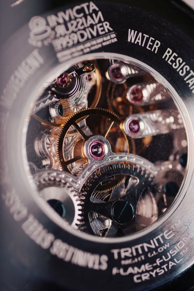 Macro of skeletonised watch gears and balance